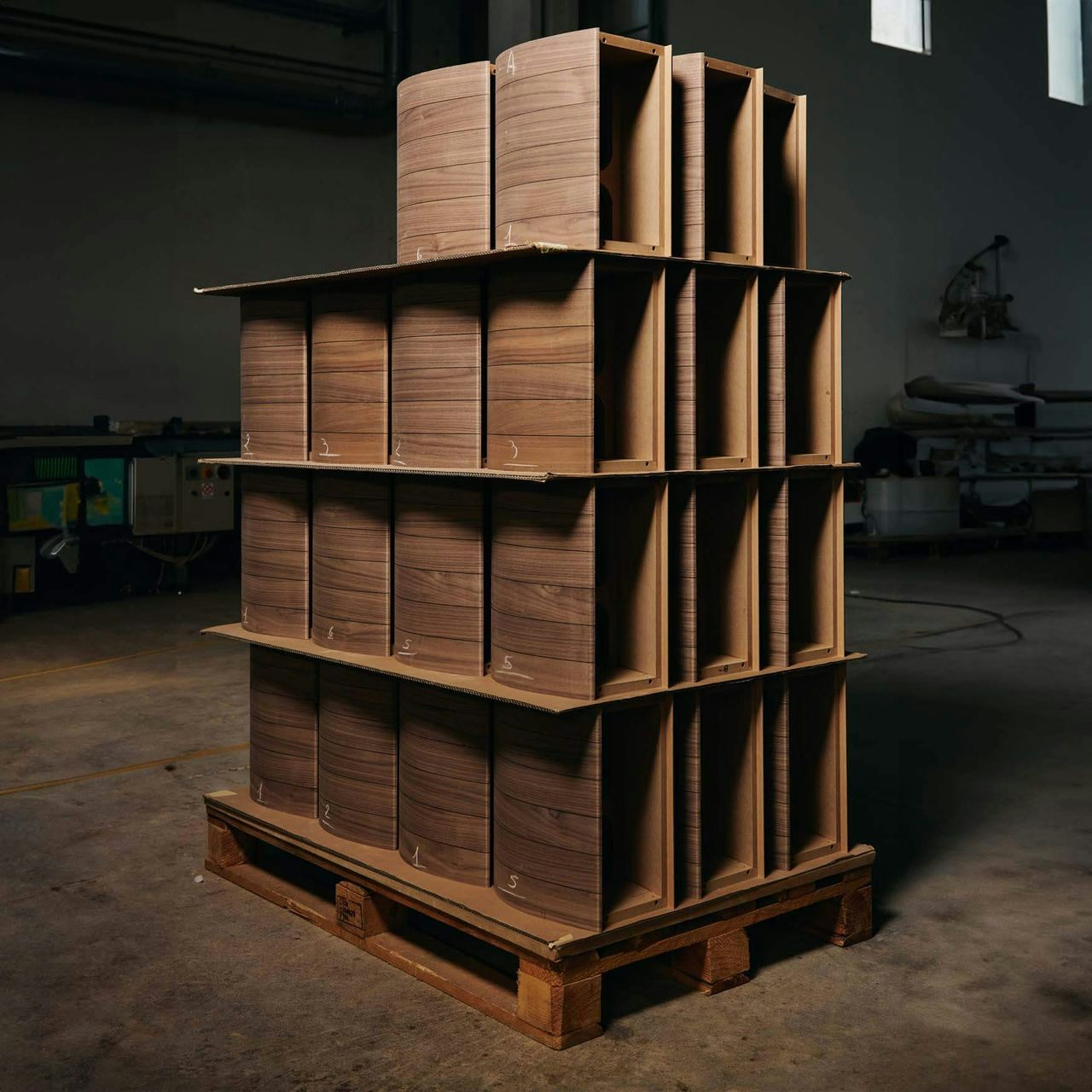 Neatly stacked, hand-sanded wood ready to be crafted into Sonus faber's Guarneri G5 bookshelf speakers.