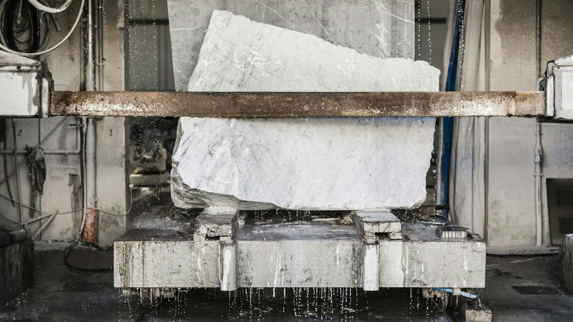 A block of Carrara Marble being readied to form bases for the Sonus faber Electa Amator III bookshelf speakers, showcasing craftsmanship.