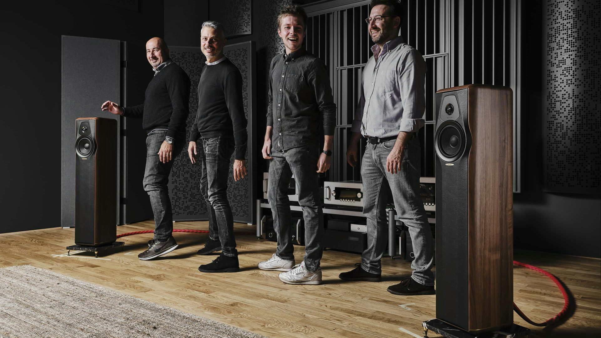 Group of people listening to the Sonus faber Maxima Amator floorstanding loudspeakers at the Sonus faber Design Lab.