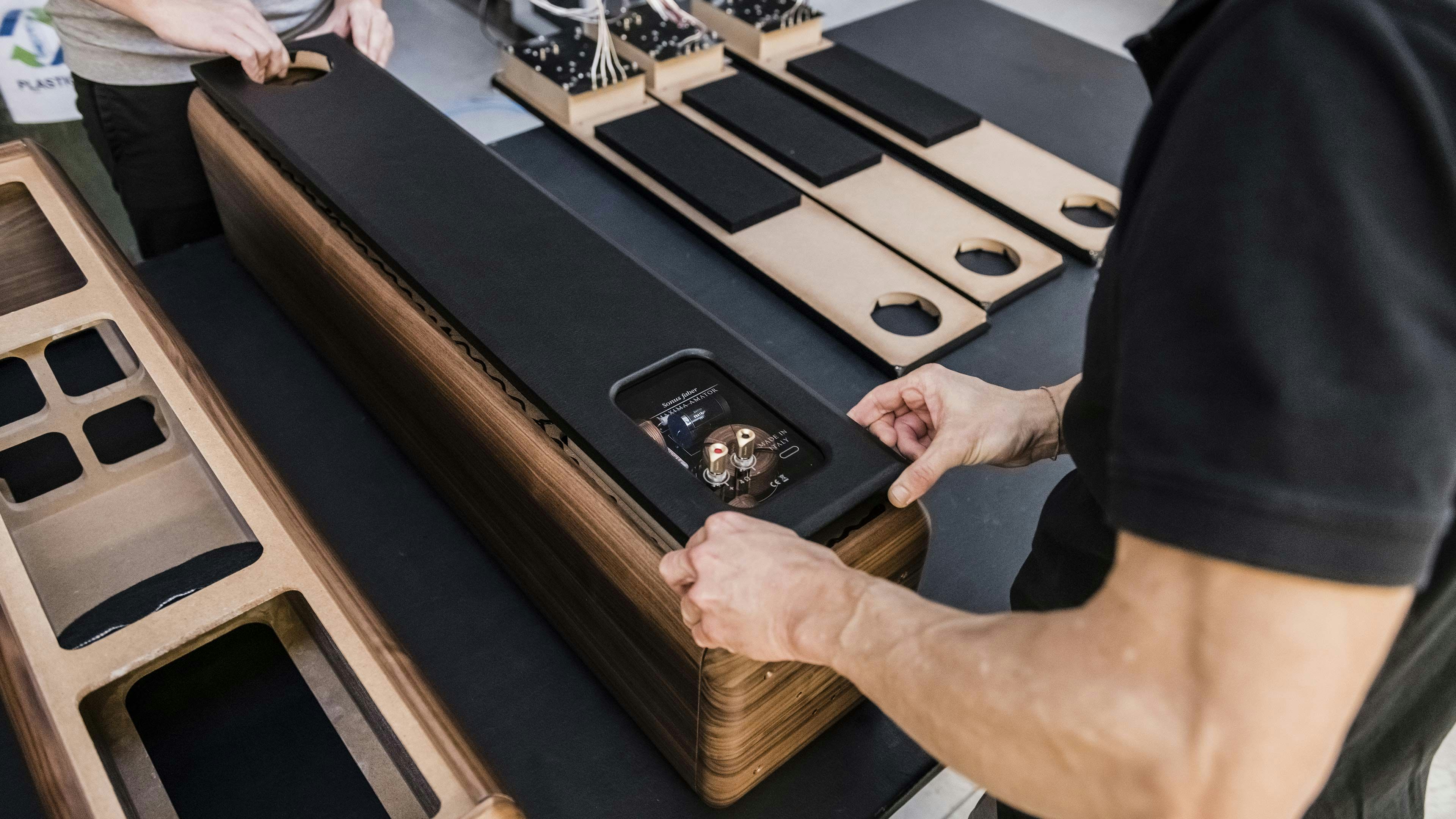 Italian artisan meticulously placing details on the Maxima Amator floorstanding speaker from the Sonus faber Heritage Collection.